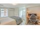 Versatile bedroom area with a bed, mini-split, and built-in desk for working from home at 928 Ashley Ave, Charleston, SC 29403