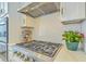Gourmet kitchen featuring a professional range, custom backsplash, and stainless steel hood at 928 Ashley Ave, Charleston, SC 29403