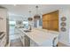 Bright, open kitchen with a large island, quartz countertops, and modern appliances offers ample seating and storage at 928 Ashley Ave, Charleston, SC 29403