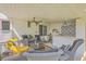 Outdoor patio with stylish wicker furniture and a ceiling fan at 928 Ashley Ave, Charleston, SC 29403
