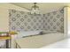 Covered patio with outdoor bar and intricate backsplash tile at 928 Ashley Ave, Charleston, SC 29403