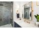 Modern bathroom featuring sleek tile, stylish vanity, and gold hardware at 10 Logan St # 6, Charleston, SC 29401