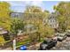 An eye-level aerial view of a gated apartment complex with manicured landscaping and ample parking at 10 Logan St # 6, Charleston, SC 29401