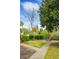 Beautiful front lawn with lush landscaping and a charming view of the church steeple in the background at 10 Logan St # 6, Charleston, SC 29401