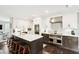 Modern kitchen featuring an island with seating, sleek appliances, and ample counter space for cooking and prep at 10 Logan St # 6, Charleston, SC 29401