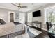 Serene bedroom with a ceiling fan, mounted tv, and plenty of natural light at 10 Logan St # 6, Charleston, SC 29401