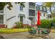 Charming patio area with wrought iron table and chairs, perfect for outdoor relaxation and entertainment at 10 Logan St # 6, Charleston, SC 29401
