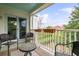 Cozy patio with stylish furniture and a scenic view from the upper floor at 10 Logan St # 6, Charleston, SC 29401