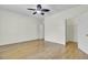 Bedroom with neutral walls and hardwood floors, with doors leading to other rooms at 100 Bridgetown Rd # 10B, Goose Creek, SC 29445