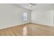 Bedroom features neutral colored walls, hardwood floors, and a window at 100 Bridgetown Rd # 10B, Goose Creek, SC 29445