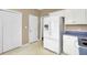 This kitchen features a white refrigerator and access to other rooms at 100 Bridgetown Rd # 10B, Goose Creek, SC 29445