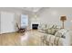 Cozy living room featuring a fireplace, hardwood floors, and plenty of natural light at 100 Bridgetown Rd # 10B, Goose Creek, SC 29445