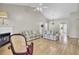 Bright living room with hardwood floors, a cozy fireplace, and an open layout at 100 Bridgetown Rd # 10B, Goose Creek, SC 29445