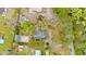Aerial view highlighting a neighborhood with private homes, mature trees, pools, and winding driveways at 1034 Orangeburg Rd, Summerville, SC 29483