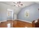Bedroom with hardwood floors, light blue walls, and plenty of natural light at 1034 Orangeburg Rd, Summerville, SC 29483