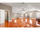 Spacious bonus room boasts hardwood floors, recessed lights, ceiling fans, and natural light from multiple windows at 1034 Orangeburg Rd, Summerville, SC 29483