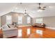 Large bonus room with hardwood floors, neutral paint, and lots of natural light at 1034 Orangeburg Rd, Summerville, SC 29483