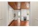 Open dining area with wood ceiling, modern cabinetry, and wine cooler, creating a stylish space at 1034 Orangeburg Rd, Summerville, SC 29483