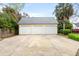 Large three-car garage with concrete driveway offers ample parking and storage space at 1034 Orangeburg Rd, Summerville, SC 29483