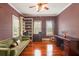 Inviting living room with green sofa, built-in shelves, and desk, ideal for work and relaxation at 1034 Orangeburg Rd, Summerville, SC 29483