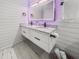 Modern bathroom featuring a double sink vanity, shiplap accent wall, and sleek marble flooring at 107 Woodland Dr, Summerville, SC 29485