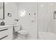 Modern bathroom with sleek white fixtures, octagon window, shiplap paneling and elegant tile accents at 107 Woodland Dr, Summerville, SC 29485