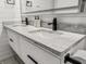 Bathroom vanity with double sinks, granite countertop, and modern black faucets at 107 Woodland Dr, Summerville, SC 29485