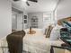 Well-lit bedroom features a comfortable bed, bright windows, and stylish decor at 107 Woodland Dr, Summerville, SC 29485