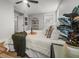 Bright bedroom featuring a cozy bed with decorative pillows and a large potted plant for a fresh, inviting space at 107 Woodland Dr, Summerville, SC 29485