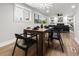 Open concept dining and living area featuring a wood table and modern lighting at 107 Woodland Dr, Summerville, SC 29485