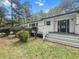 Charming brick home with dark trim and a welcoming front porch with inviting entrance at 107 Woodland Dr, Summerville, SC 29485