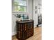 Unique wood cabinet in a modern kitchen with stainless steel appliances at 107 Woodland Dr, Summerville, SC 29485
