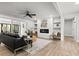 Bright living room with a fireplace, comfortable seating, and modern decor, creating an inviting space for relaxation at 107 Woodland Dr, Summerville, SC 29485