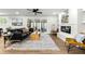 Cozy living room featuring a fireplace, wood floors, modern furniture and natural light at 107 Woodland Dr, Summerville, SC 29485