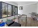 Bright sun room with large windows, brick wall and wood floors at 107 Woodland Dr, Summerville, SC 29485