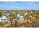 Aerial view of two story house, fenced in yard, and waterfront at 1115 Barfield St, Charleston, SC 29492