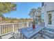 The back deck features a dining table, chairs and beautiful natural views at 1115 Barfield St, Charleston, SC 29492