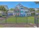Spacious backyard featuring lush lawn, screened porch, and raised deck, perfect for outdoor entertaining at 1115 Barfield St, Charleston, SC 29492