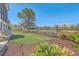 A fenced-in backyard space with lawn, trees, and decorative landscaping at 1115 Barfield St, Charleston, SC 29492