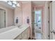 Charming bathroom featuring a single sink vanity, cabinets, and access to the bedroom at 1115 Barfield St, Charleston, SC 29492