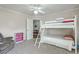 Bunk bed, bookshelf, and armchair for relaxation; a perfect space for or guests at 1115 Barfield St, Charleston, SC 29492