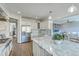 Bright kitchen featuring white cabinets, stainless steel appliances, and a marble countertop island at 1115 Barfield St, Charleston, SC 29492