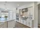 Bright kitchen featuring stainless steel appliances, white cabinetry, and granite countertops at 1115 Barfield St, Charleston, SC 29492