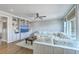 Cozy living room with built-in shelving, large white sofa and ceiling fan at 1115 Barfield St, Charleston, SC 29492
