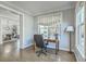 Comfortable office space with hardwood floors, desk, and adjacent living area view at 1115 Barfield St, Charleston, SC 29492