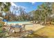 Outdoor pool and hot tub with lounge chairs and tables for community use at 1115 Barfield St, Charleston, SC 29492