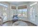 Sunlit sitting area with a cozy chair, soft rug, and a view of outdoors at 1115 Barfield St, Charleston, SC 29492