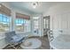 Inviting sitting area with a comfortable chair, rug, and an abundance of natural light at 1115 Barfield St, Charleston, SC 29492