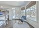Cozy nook with a cushioned chair, round rug, and views of the outdoors at 1115 Barfield St, Charleston, SC 29492