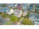 Two-story home with a front porch, a detached garage, a driveway, and a well-maintained yard in a neighborhood setting at 112 Tin Can Aly, Summerville, SC 29483